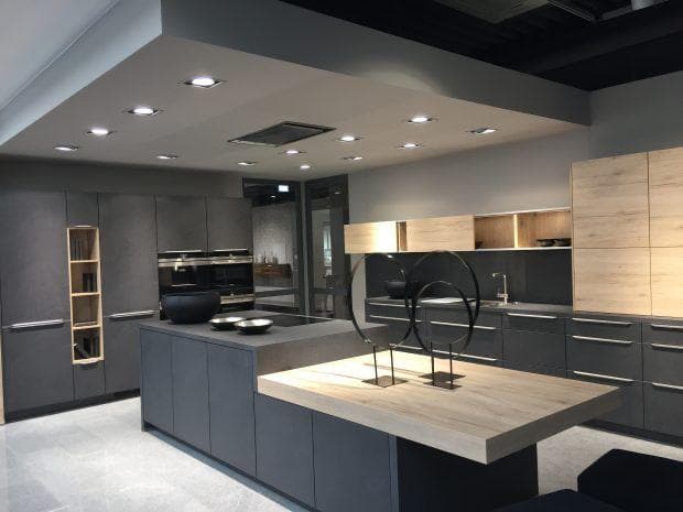 Modern grey and wood-tone kitchen island cabinetry