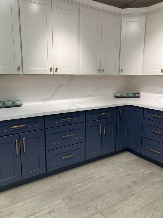 Navy and white two-tone kitchen with gold hardware
